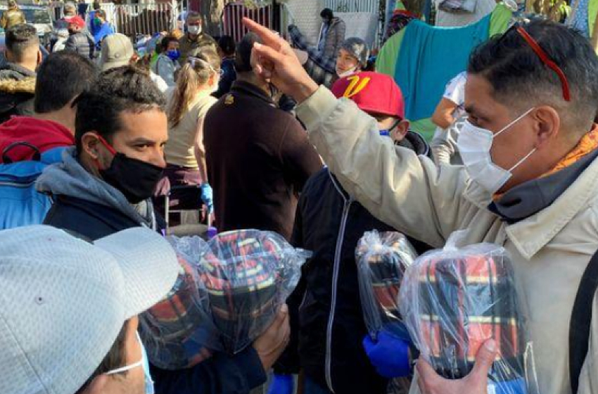 Seeking to return home, Venezuelan & Peruvian migrants camp outside embassies in Chile