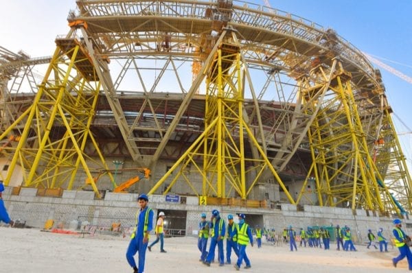 Workers walk towards the construction site of the Lusail Stadium for Qatar 2022 FIFA World Cup