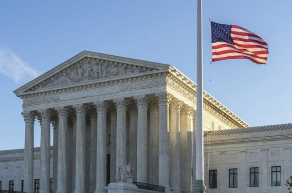 Flags fly at half-staff at the United States Supreme Court