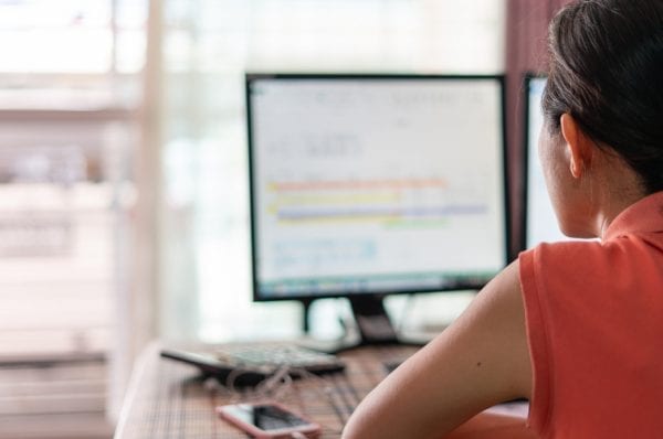 Woman working her job from home by using computer connect to her office