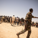 over 300 migrants detained in libyan desert by military forces